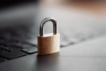 Poster - Security concept. Padlock on laptop keyboard signifies digital safety, data protection, and online privacy. Use for cybersecurity, IT, finance, or personal security themes.