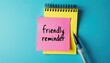 © Viktor - Illustration shows pink sticky note with handwritten text friendly reminder over yellow notepad. Pen lies nearby on blue background. Concept for project deadlines, task management, scheduling,