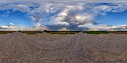 Wall Mural - hdri 360 panorama view on crossroads of gravel country roads among fields with clouds in sky in equi