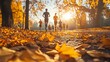 © harjiyo - Runners enjoying autumn park run.  Golden leaves carpet a path as runners jog through a beautiful autumn morning