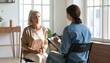 © Cintia - Thoughtful senior woman in therapy session with therapist taking notes in bright room