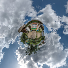 Wall Mural - simple tiny planet with wooden home or homestead building in blue sky with beautiful clouds. transfo