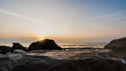 Wall Mural - rock sea beach sunset sky water nature background, stone podium product stand display on sun dawn oc