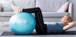 © Prostock-studio - Fit mature lady exercising her abs muscles with fitball on yoga mat at home, copy space. Side view of sporty senior woman leading active lifestyle, working out during coronavirus lockdown