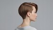 © Muhasnumay - Stylish Pixie Cut: A stunning portrait showcases a woman's elegant side profile, with a fashionable short pixie haircut with expertly layered and styled hair, captured in a refined studio setting.