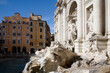 © yaqui_villegas - Diagonal composition of Fontana di Trevi in Rome under bright daylight with partial shadows, highlighting sculptural richness and classical elements in a lively Roman piazza setting.