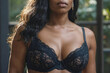 © polack - Sexy African American woman with a large bust is wearing a black lace bra. The bra is very full and has a lot of lace