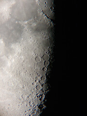 Wall Mural - half moon photograph through a telescope.