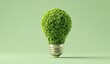 © Popu - 3D render of a green light bulb made from small grass, isolated on a soft Green Background