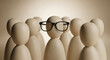 © MD NAZMUL - Smart figure wearing glasses stands out from a crowd of wooden figurines