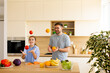 © BGStock72 - Joyful moments of juggling fruits in a bright kitchen with loved ones