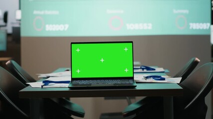 Poster - Boardroom is staged for success with green screen and forecasting visuals in empty office at night, ideal setting for corporate alignment and late project briefings. Management tools.