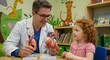 © pisang - Doctor teaching child about heart