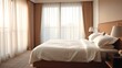 © Wendy - Stylish hotel room with crisp linens and morning sunlight filtering through sheer curtains.