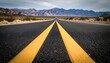 © Ana - Open Road to Mountains Asphalt highway with yellow lines and scenic desert landscape.