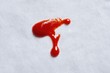 © rin.id - Ketchup Stain on White Fabric: Vibrant Red Spill on Textured Background