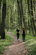 © dsheremeta - Women enjoying outdoor exercise in forest setting
