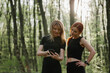 © dsheremeta - Women engaging in outdoor fitness activity in forest