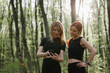 © dsheremeta - Women exercising outdoors in sunlit forest