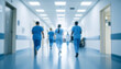 © miracle - Blurred hospital corridor with medical equipment and healthcare professionals in motion, healthcare concept background