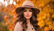© skynds - Autumn fashion portrait of a beautiful woman in a stylish fedora hat against a background of golden fall leaves