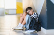 © Serhii - Schoolboy crying on floor after bullying incident