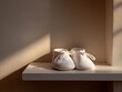 © Evgeniia - Delicate baby shoes sit untouched on a bare shelf. A tender visual metaphor for infertility, child loss, or emotional journey through pregnancy loss