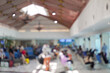 © Reezky - Blurry image of a crowded airport lobby or airport lounge with people waiting to boarding the plane.