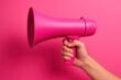 © Albert - A Hand Holds Pink Boombox Against a Pink Backdrop