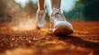 © Pat J. - a close-up shot of tennis shoes sliding on a clay court, dust particles visible, shallow depth of field