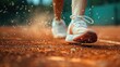 © Pat J. - a close-up shot of tennis shoes sliding on a clay court, dust particles visible, shallow depth of field