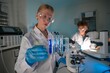 © FotoArtist - Young scientists conducting experiments in a modern laboratory after school hours