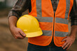 © miftah - Construction Worker Holding Yellow Safety Helmet – Industrial Theme