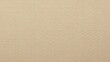 © Nawal - Close up of textured light brown fabric or canvas material