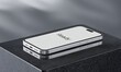 © Edi - Smartphone Mockup Silver Device on Dark Surface Ready for App Presentation or Technology Adve