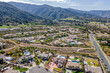 © HunYoung - Corona, CA, LA County, February 28, 2025: Aerial View of Village of Corona around Upper Dr, Mountain Gate Park, De La Torre Family Day Care, Foothill Pkwy with Mountain, Houses, Homes, Roads
