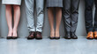 © Marius - Professional Business Attire of Diverse Individuals Standing in a Row Featuring Stylish Footwear and Legs