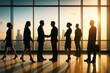 © Pixels Hunter - Business people networking and shaking hands in office with city background and warm light during sunrise, teamwork and corporate success concept.