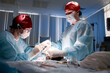 © Georgii - Medical professionals performing surgery in a clinical setting with concentration