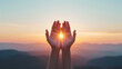 © AH TAR STOCK - A person's hands are open to the sun, symbolizing peace and hope