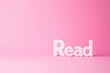 © GodNemesis Art Fanta - Read in Pink: A simple, elegant composition of the word Read rendered in pristine white 3D letters, set against a soft, vibrant pink backdrop.