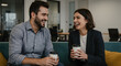 © Hilman Parid Mubaroq - Joyful Office Break: Happy Male and Female Colleagues Laughing and Enjoying a Casual Coffee Conversation in a Modern Workplace