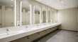 © Upin - Modern restroom with multiple sinks and mirrors.