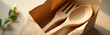 © fotoluigi868 - wooden spoon fork set nestled within kraft paper wrapping illuminated soft natural light subtle texture details