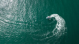 Aerial view of man riding jet ski on Baltic sea.