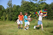 © New Africa - Children with colorful kite running in nature