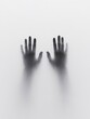 © CreativeSuburb - Shadowy hands reaching out from behind frosted glass