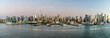 © Nicola - A panorama view approaching dusk from the Hudson River across the skyline of Manhattan, New York, in the fall