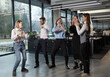 © ASDF - A group of people are dancing in a room