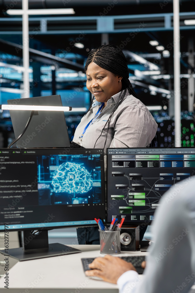 Server room system administrator using artificial intelligence to ...